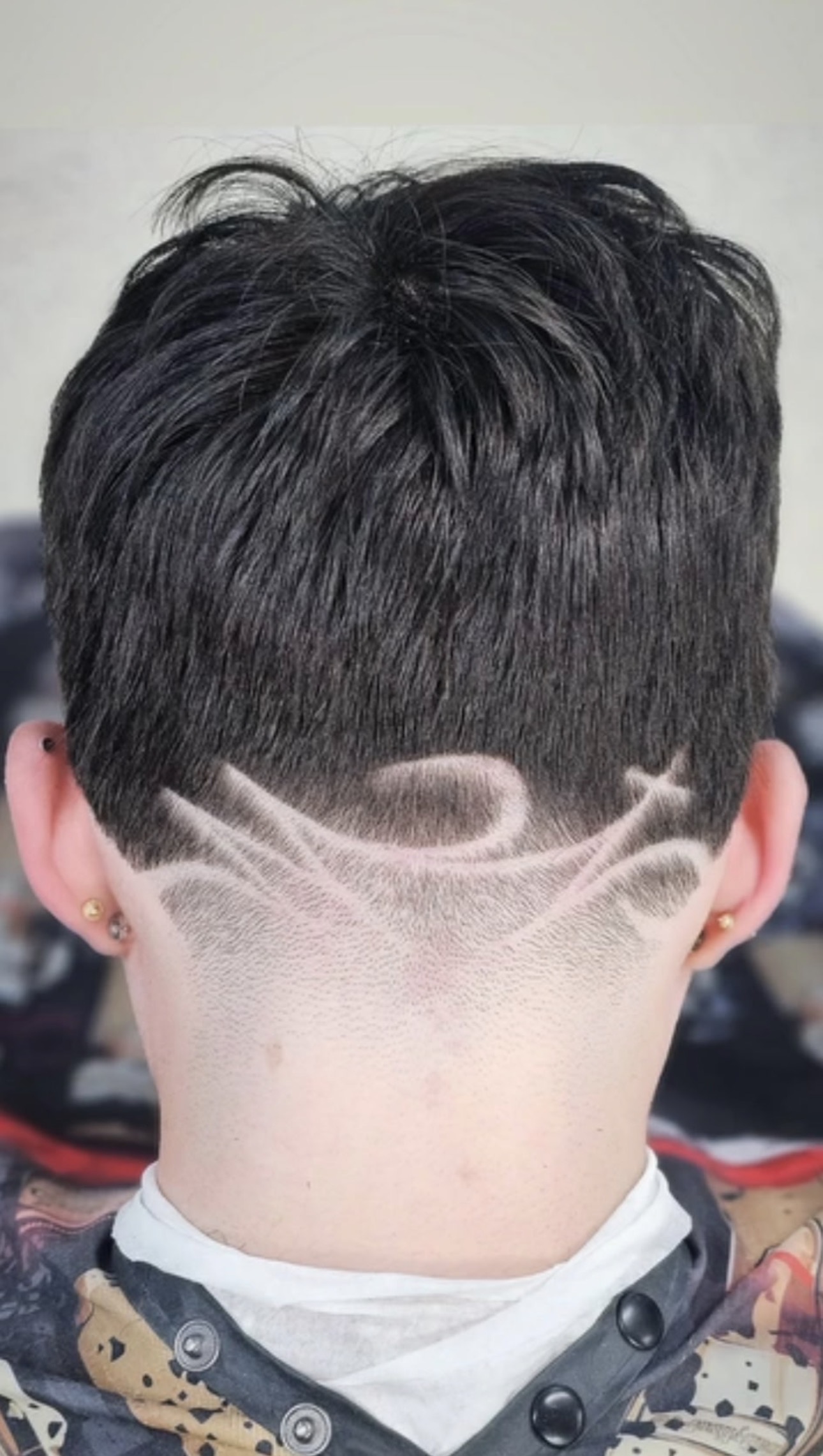 Detailed freehand pattern carved into a taper fade